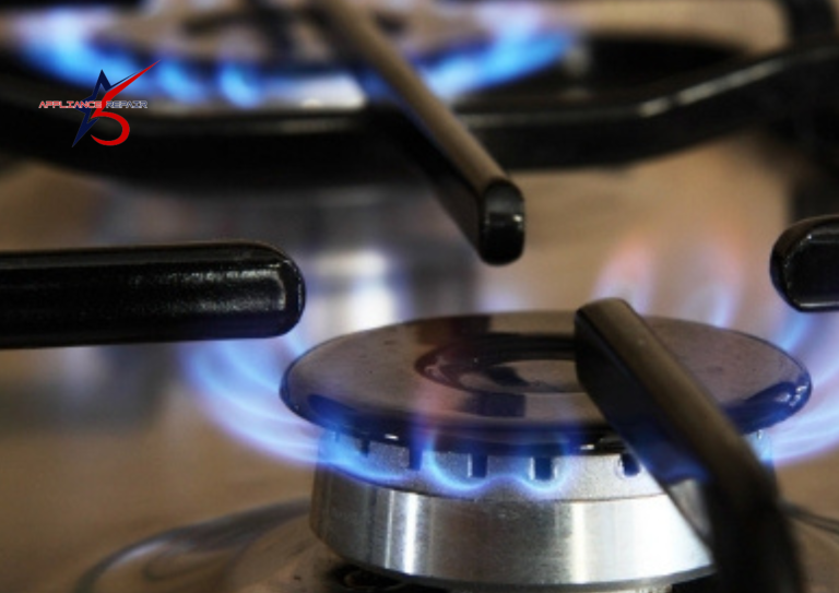Lit gas cooktop burners with clean blue flames, illustrating a functional ignition system.
