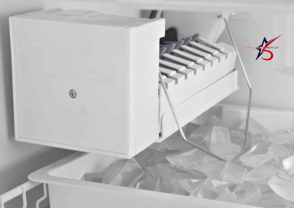 A black and white close-up of a standard residential refrigerator ice maker unit mounted inside a freezer, featuring the harvest mold and the metal shut-off arm over a full bin of ice.